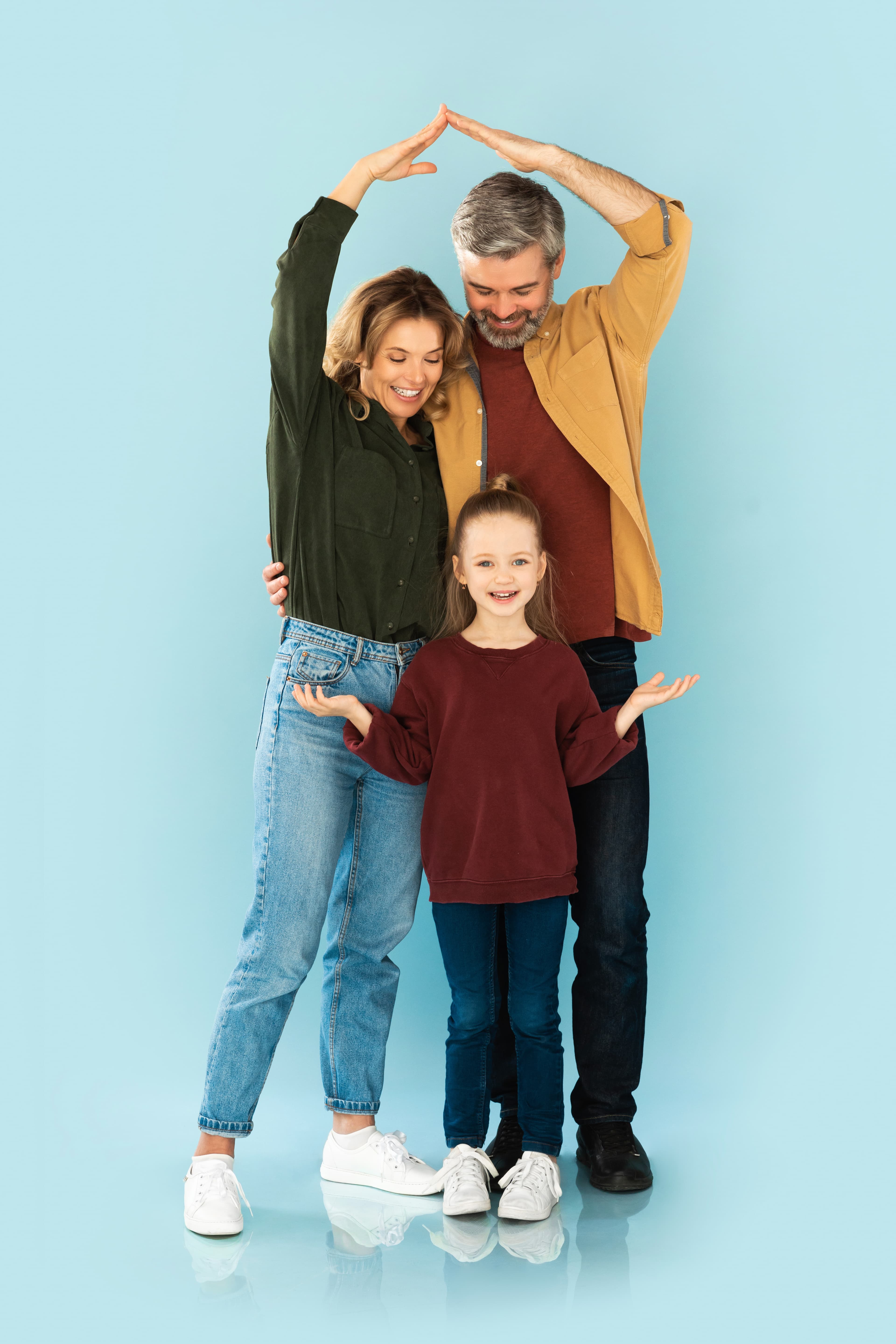 Family standing in front of a new home